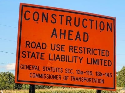 An orange "Construction Ahead" sign