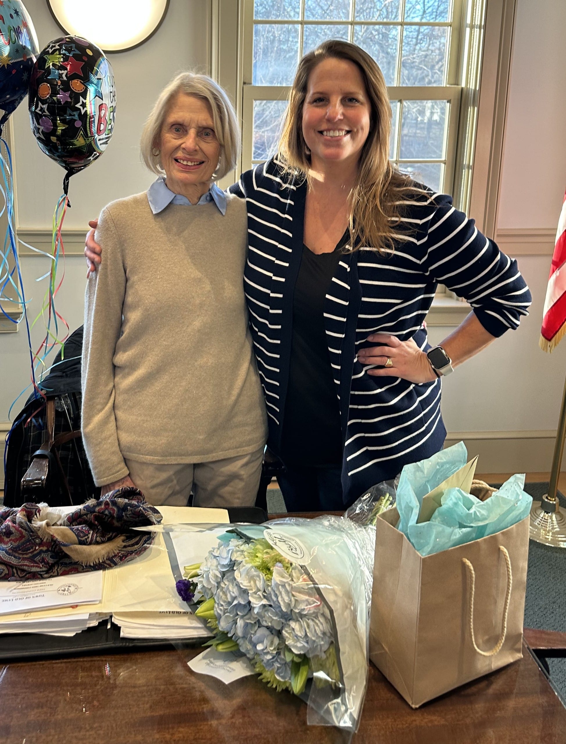Emily Griswold puts arm around Joanne DiCamillo for posed photo.
