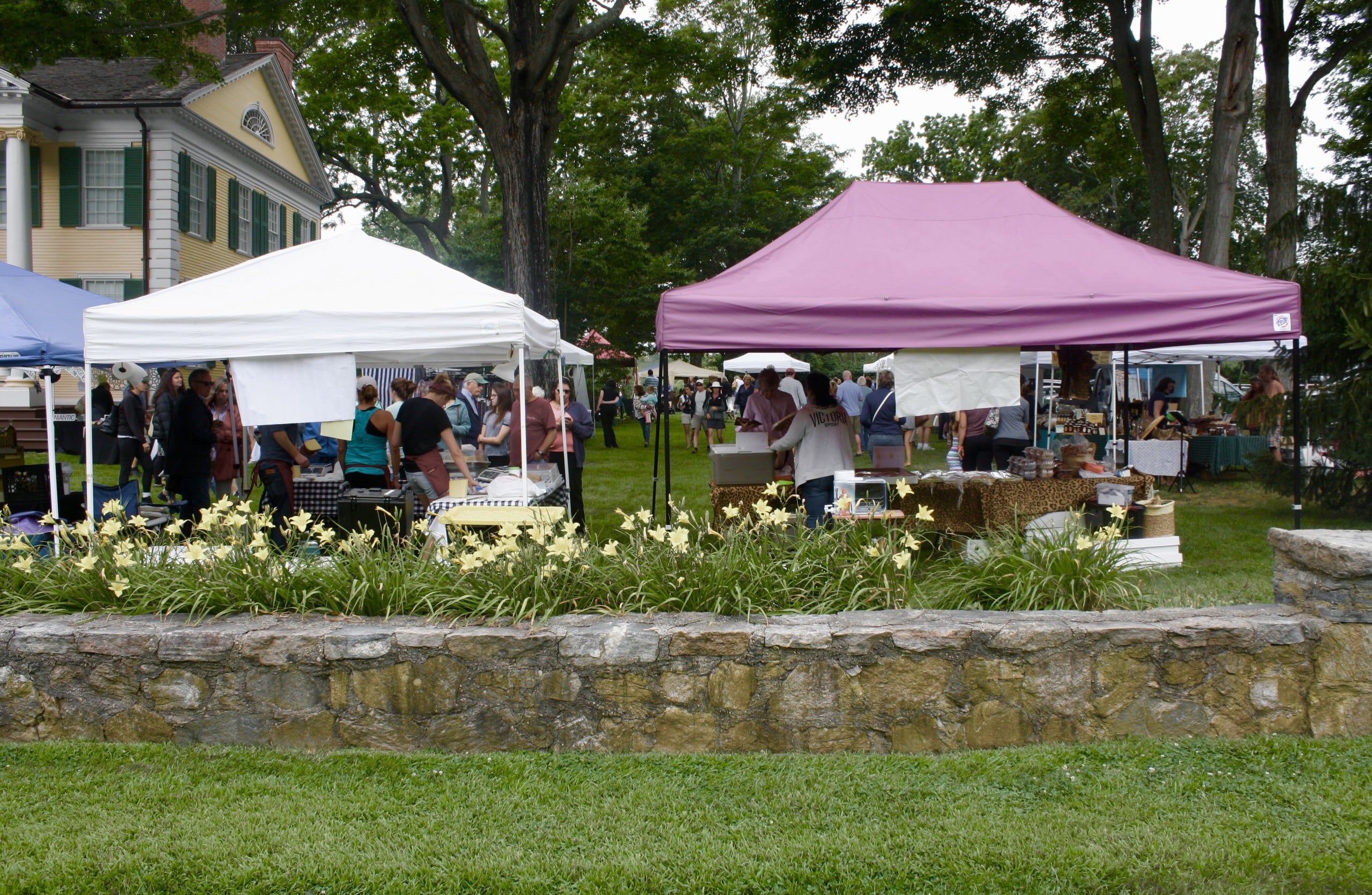 Booths are laid out in front of the Florence Griswold Museum. 