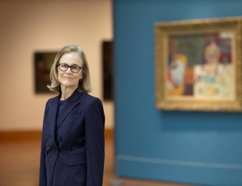 Dita Amory poses in front of a painting at the Met