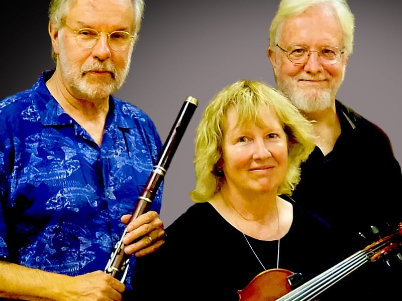 Jim Sirch with an Irish flute, Willow Sirch with a fiddle and Gary Wikfors pose for a photo.