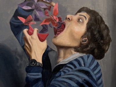 What appear to be paper birds fly out of a person's mouth.