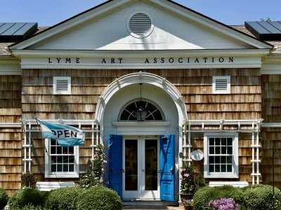 Entrance to the Lyme Art Association under a blue sky.