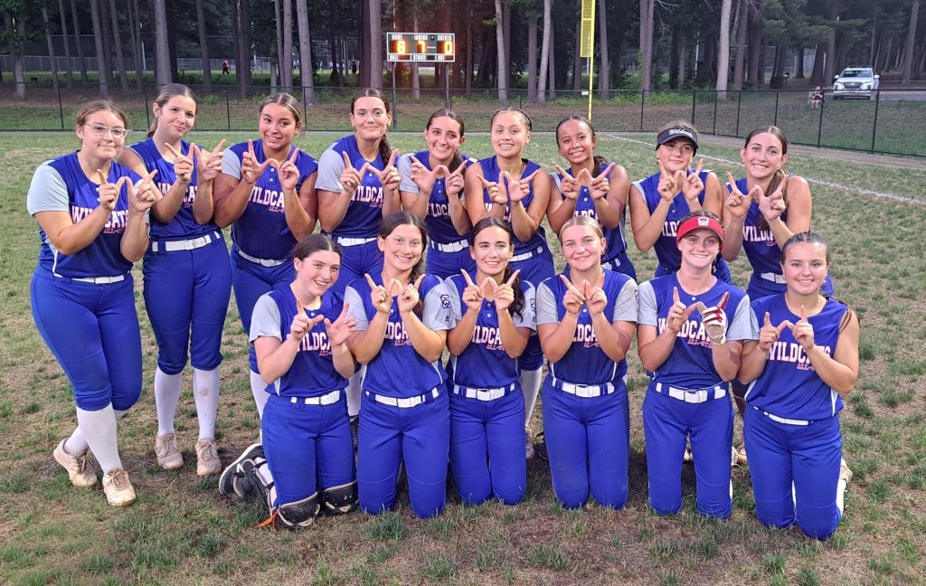 Girls in two rows make "W" signs with fingers.